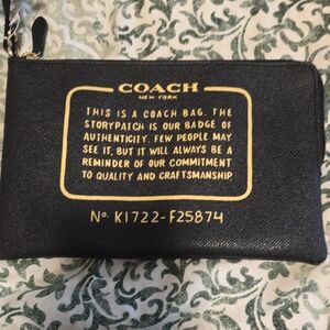 Coach Black Wristlet with Gold Text